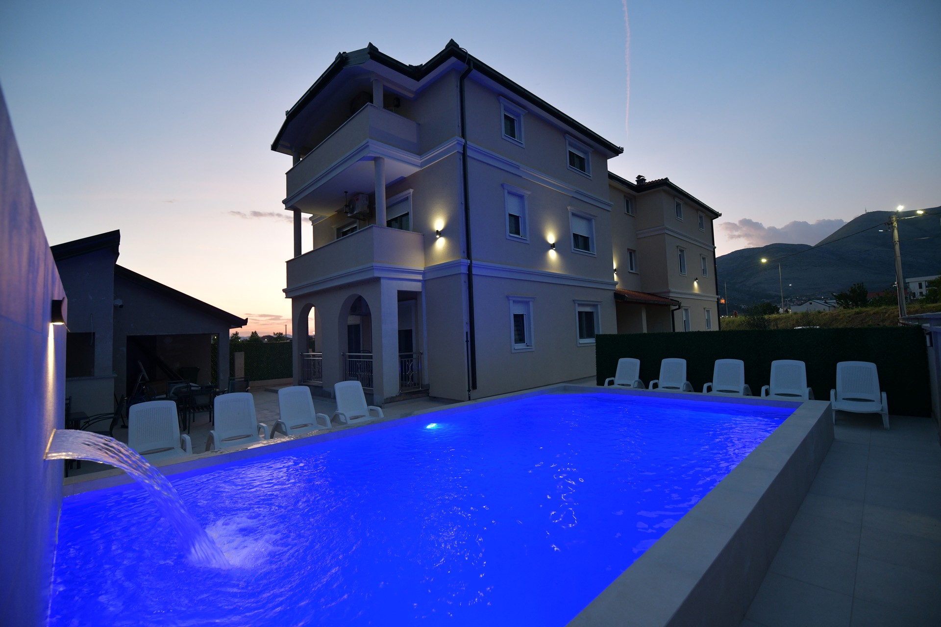 Guests relaxing by the pool
